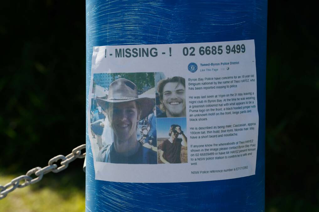 Posters are stuck to poles and windows throughout Byron Bay, asking for any new information and sharing photos of a smiling young Theo who has been missing for two weeks. Picture: Danielle Smith.