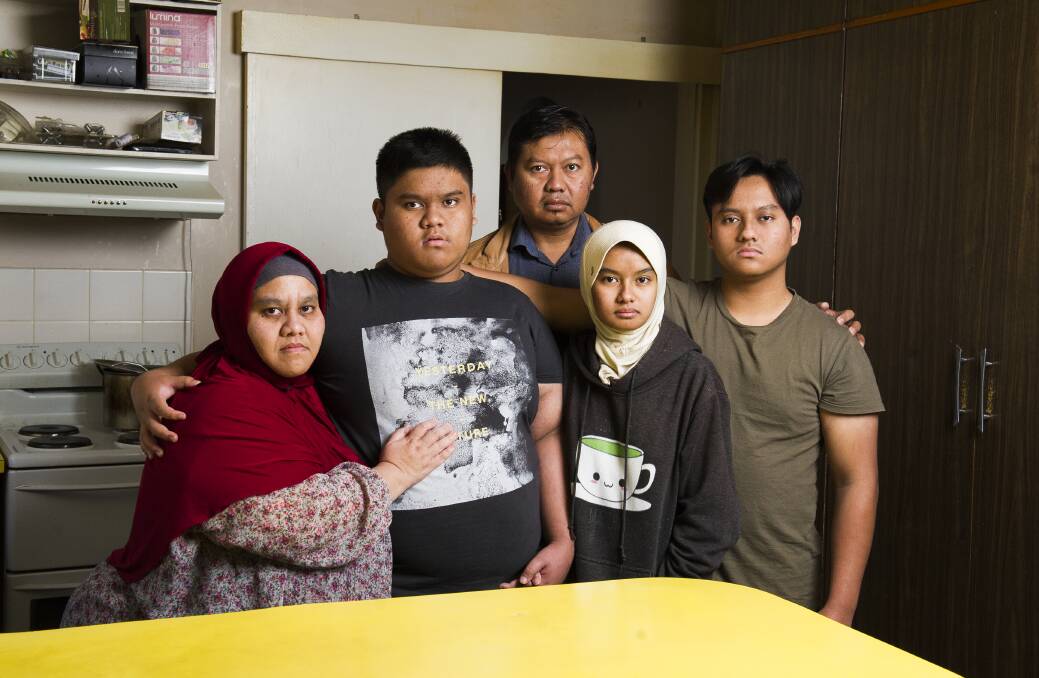 Yuli Rindyawati and partner Heri Prayitno and their children (from left) Dimas Triwibowo, Adela Ramadhina and Ferdy Dwiantoro say they have deep ties to the Canberra community. Picture: Dion Georgopoulos