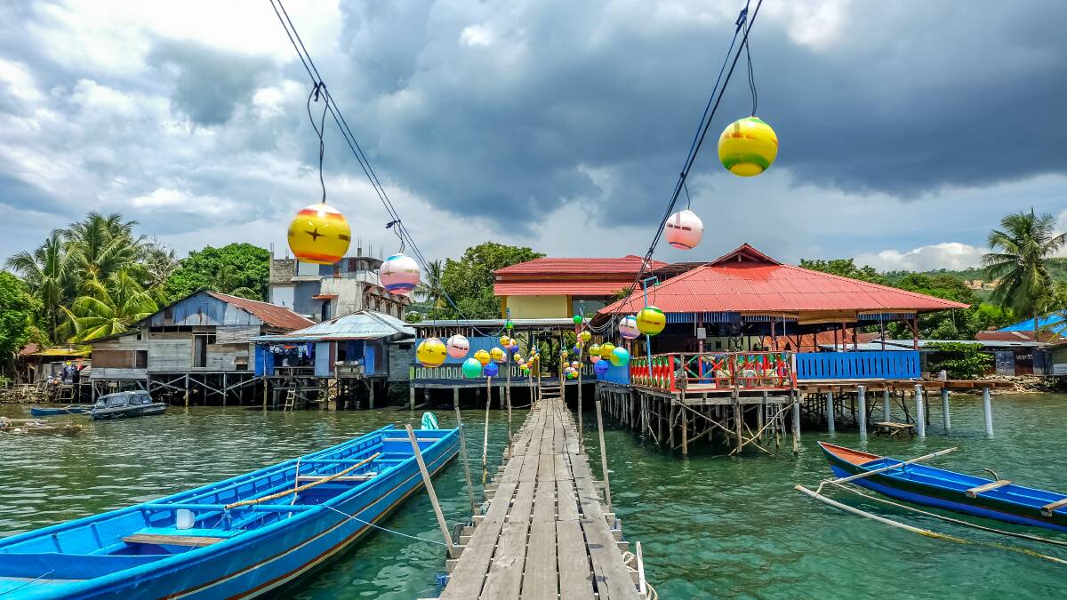 A small pier leads to wooden houses on stilts in Ambon, Maluku, Indonesia. Pictures: Shutterstock