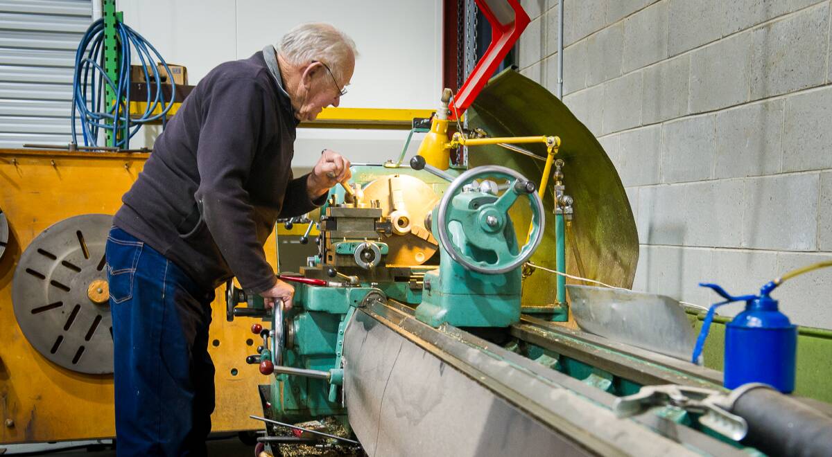 Colin Ogilvie works on a on machining lathe. Picture: Elesa Kurtz