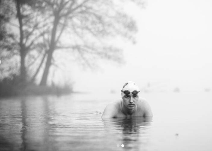 Picture by @karleenminneyphotographer: Ice swimmer Ben Freeman training in Lake Burley Griffin.