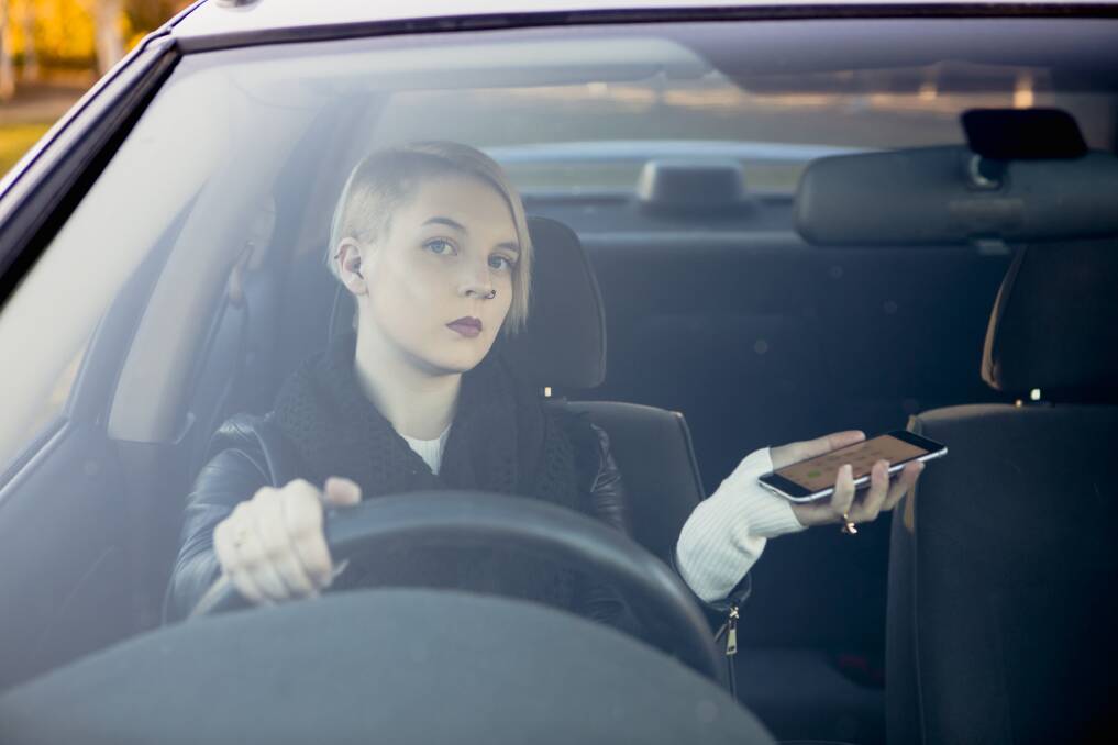 P-plate driver Chloe Smith is angry about new driving laws in the ACT. The laws will ban L-plate and P-plate drivers from using their mobiles phones while driving, including when using a hands-free device. Picture: Jamila Toderas