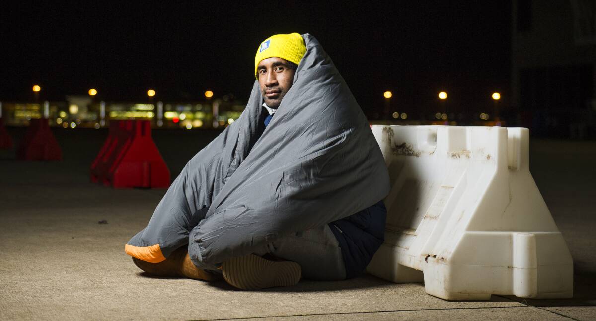 Raiders prop Sia Soliola walked a mile in a homeless person's shoes at the Vinnies CEO's Sleepout at the Canberra Airport on Thursday night. Picture: Dion Georgopoulos