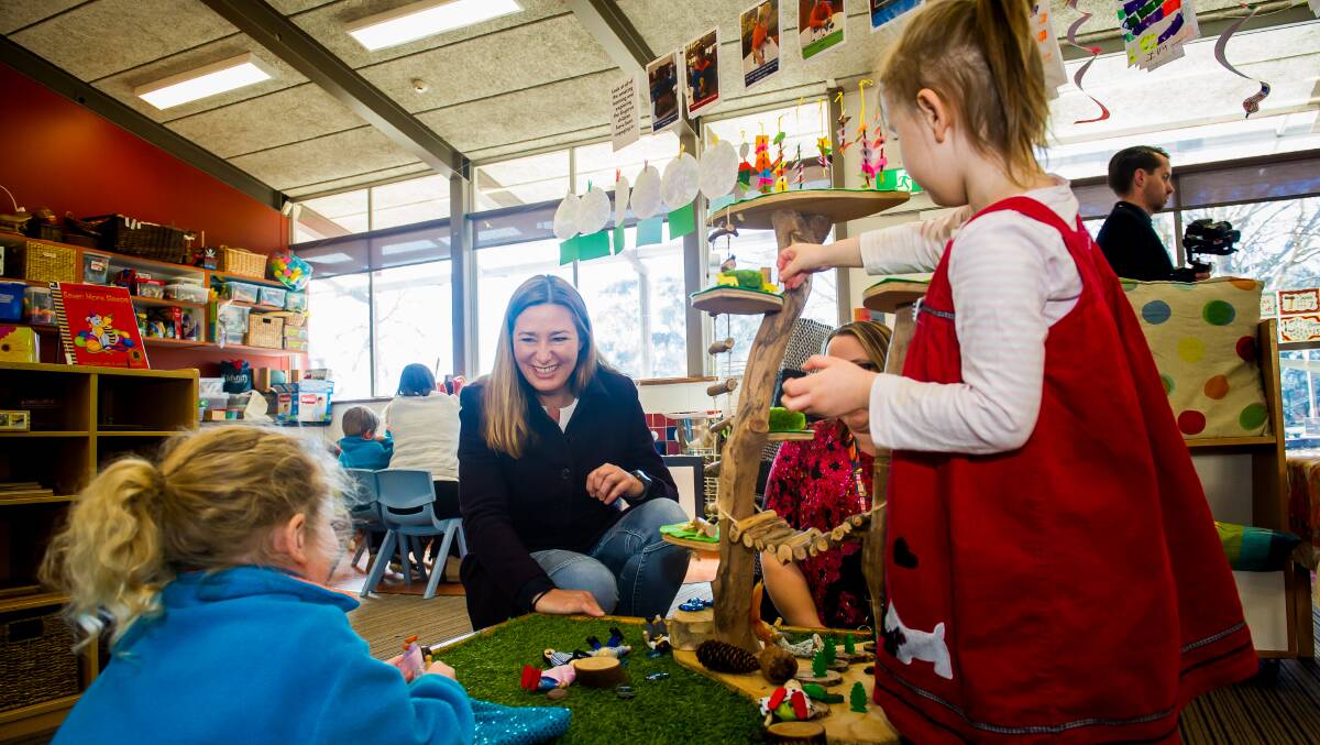ACT Education Minister Yvette Berry with Southern Cross Early Childhood School preschoolers Penny Ayton and Ayesha Haynes, and classroom teacher Kellie Rogers. Picture: Elesa Kurtz
