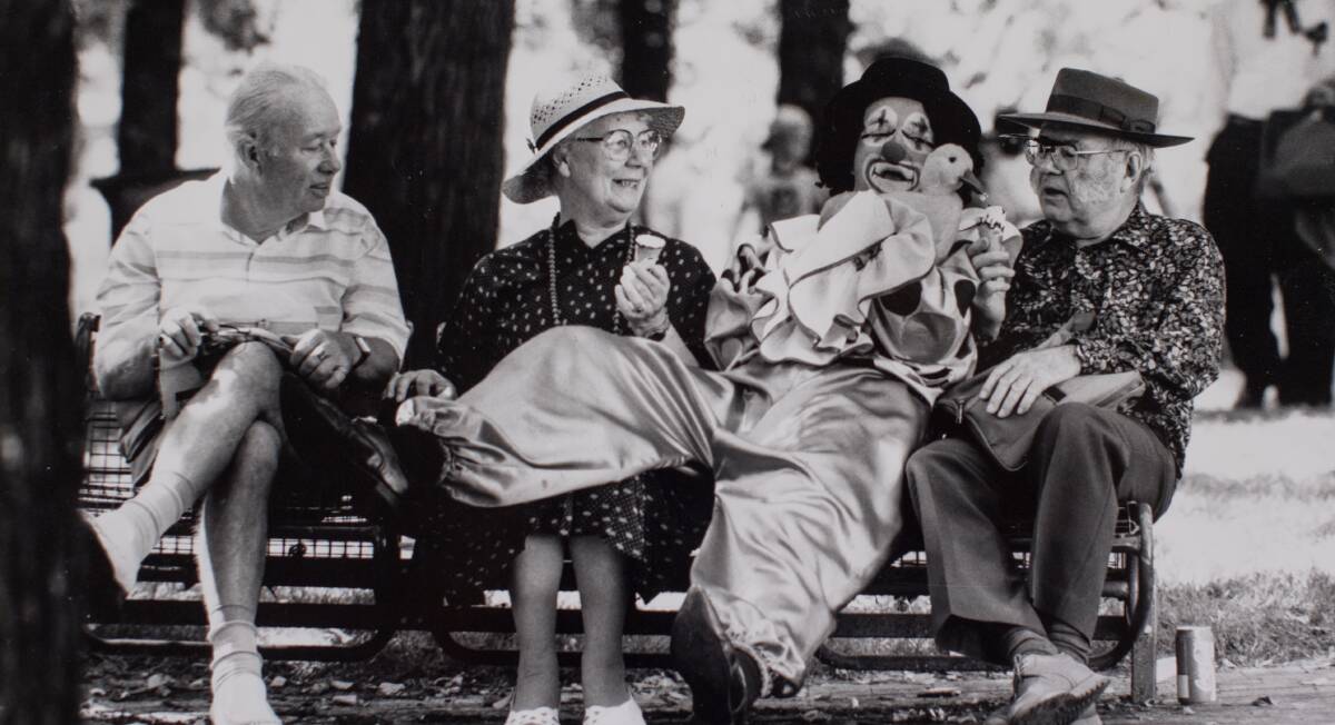 Canberra Festival at Glebe Park. Hans Gunther of Page (left) and Jean and Geoffrey Calderwood of Curtin with a clown and his pet duck in 1992.