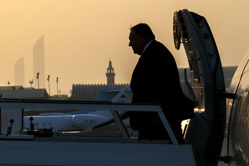 Secretary of State Mike Pompeo exits the plane at sunset as he arrives in Abu Dhabi. Picture: AP