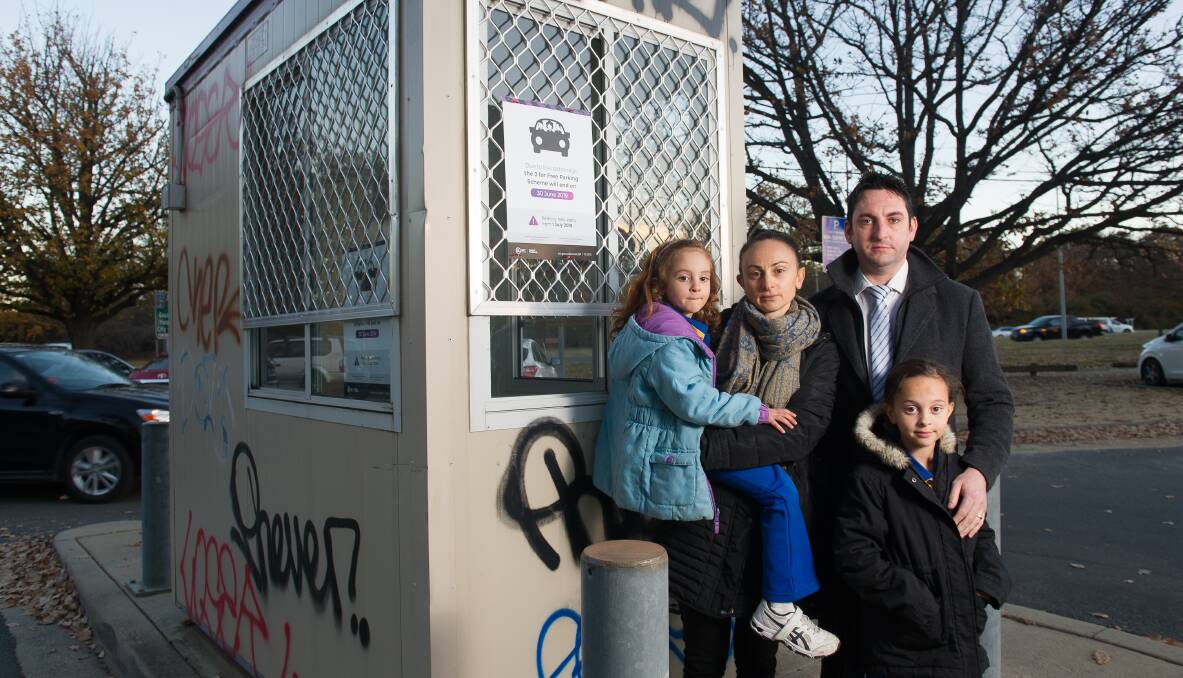 Doug Courtney with his family Olivia, Tania and Claudia have been using free parking scheme designed to encourage carpooling which has now been axed by the ACT government due to low uptake. Picture: Elesa Kurtz