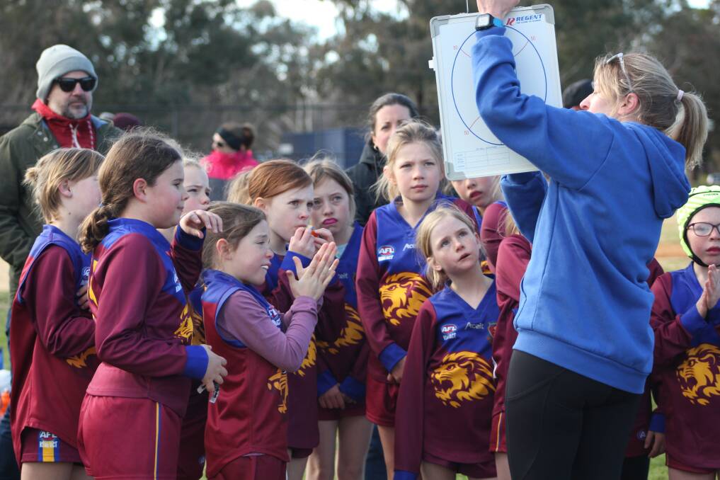 Luke Hickey's picture of wife Eugenie coaching the under 10 girls' team for the Tuggeranong Lions. Picture: Luke Hickey