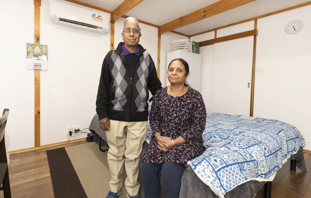 Vish and Uma Ramasubramanian, who live in a granny flat behind their son's house. Mrs Ramasubramanian is looking to help her friend, who is a single mother, crack Canberra's rental market. Pictures: Sitthixay Ditthavong