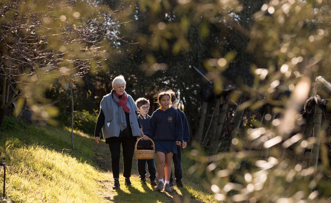 Stephanie Alexander with grade four students from Altona North, Connor Ebsworth, Lachlan Marshall and Marcia Wilson at the Rose Creek Estate, in East Keilor. Picture: Jason South