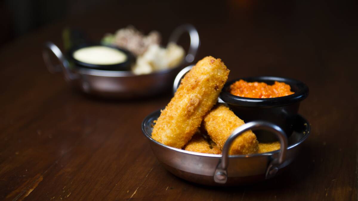 Crumbed haloumi with romesco sauce, front, and salt and lemon pepper dusted baby calamari. Picture: Dion Georgopoulos