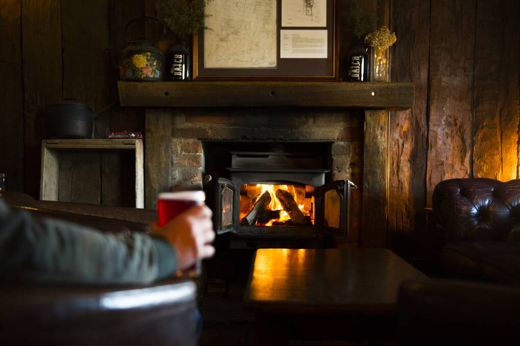 Warm up by the fire at The Old Canberra Inn. Picture: Dion Georgopoulos