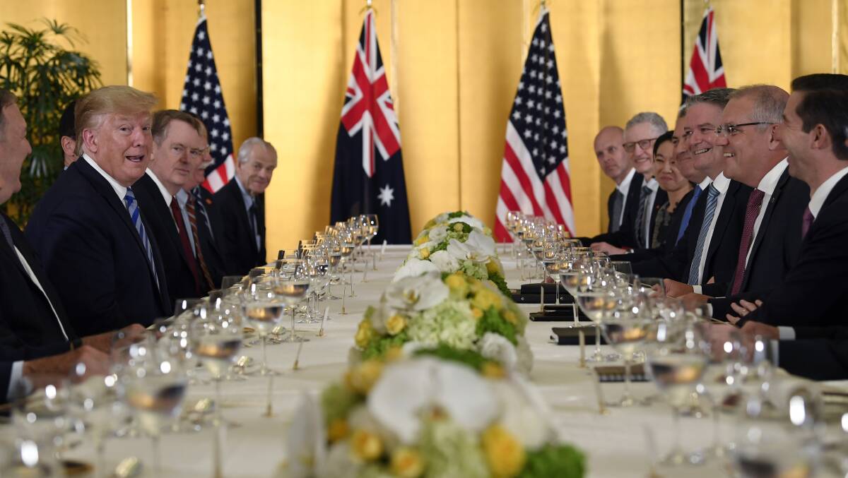 President Donald Trump, second from left, attends dinner with Australian Prime Minister Scott Morrison, second from right, in Osaka, Japan, on Thursday. Picture: AP Photo/Susan Walsh
