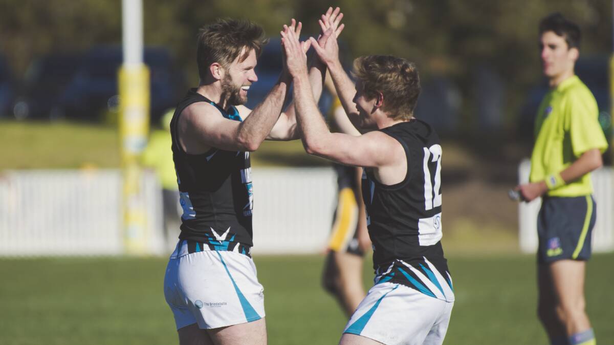 Alex Bennett and Matt Kelly celebrate during Belconnen's triumph over the Tigers behind enemy lines. Picture: Jamila Toderas