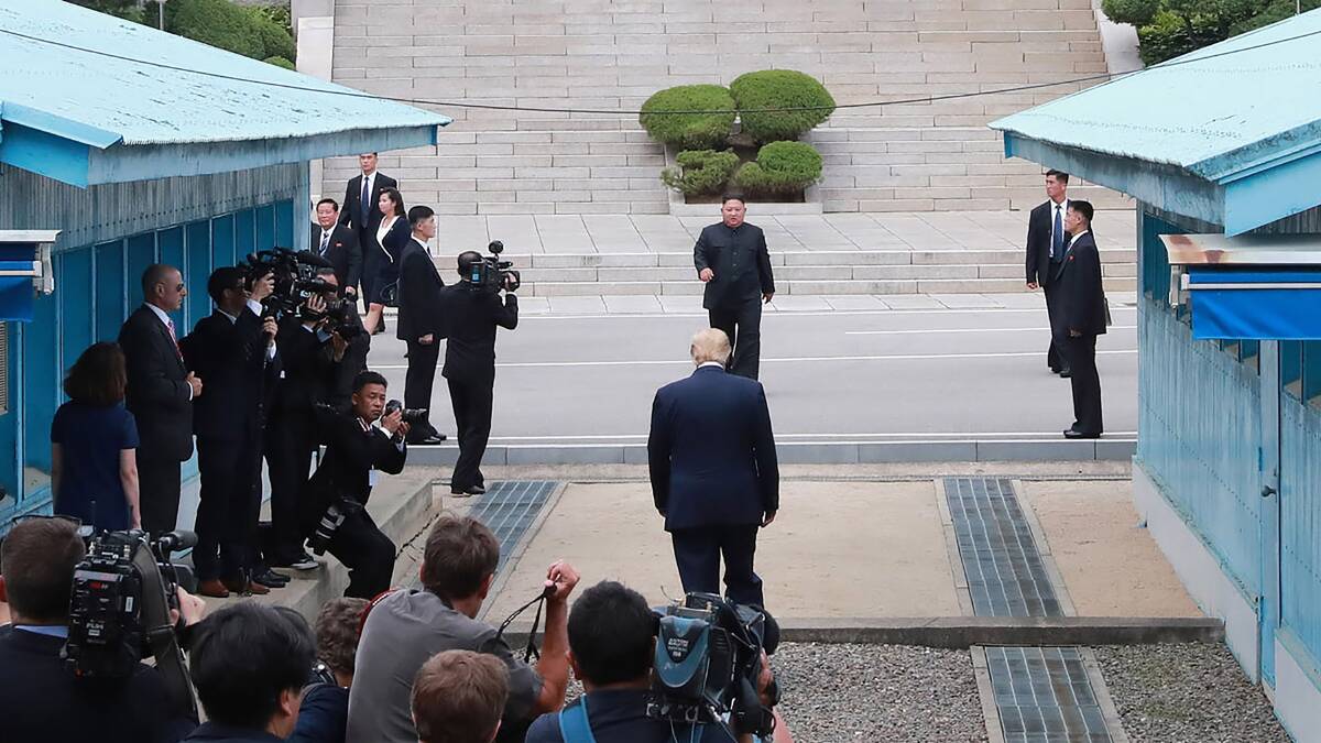 North Korean leader Kim Jong Un meets US President Donald Trump at the border village of Panmunjom in Demilitarised Zone on Sunday. Picture: Korea News Service 