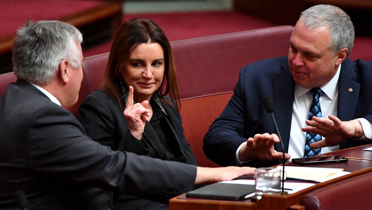 Jacqui Lambie with Centre Alliance senators Rex Patrick (left) and Stirling Griff in the Senate on Tuesday. Picture: AAP