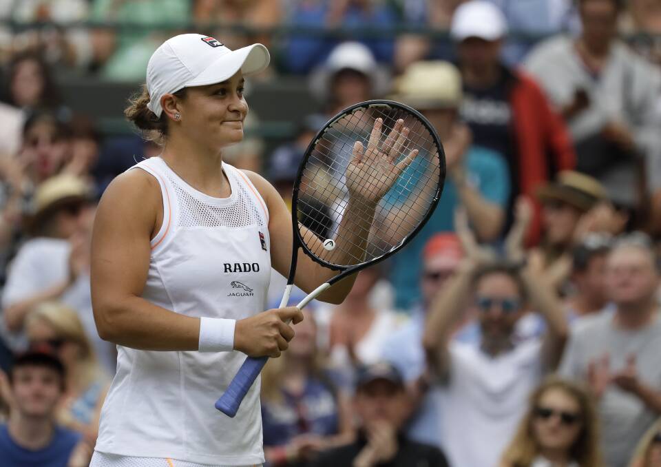 Australia's Ashleigh Barty celebrates after beating China's Saisai Zheng in their Women's singles match at Wimbledon. Picture: AP