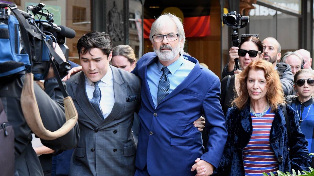John Jarratt (centre) walks from court with his wife and lawyer after he was found not guilty of rape. Picture: AAP Image/Peter Rae