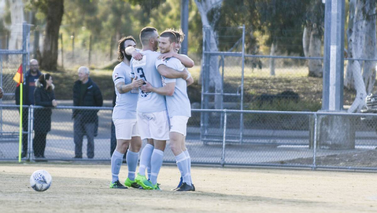 Belconnen United celebrate after defeating Canberra FC 2-1 at McKellar Park. Picture: Dion Georgopoulos