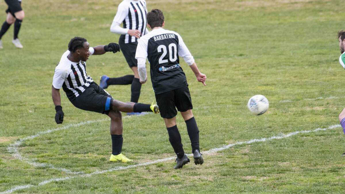 Micheal John scores for Gungahlin United during Sunday's clash with Tuggeranong United. Picture: Sitthixay Ditthavong