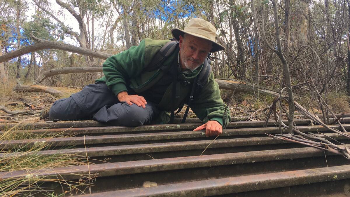 David Wardle inspects a grid on the old Apollo Road. Picture: Tim the Yowie Man