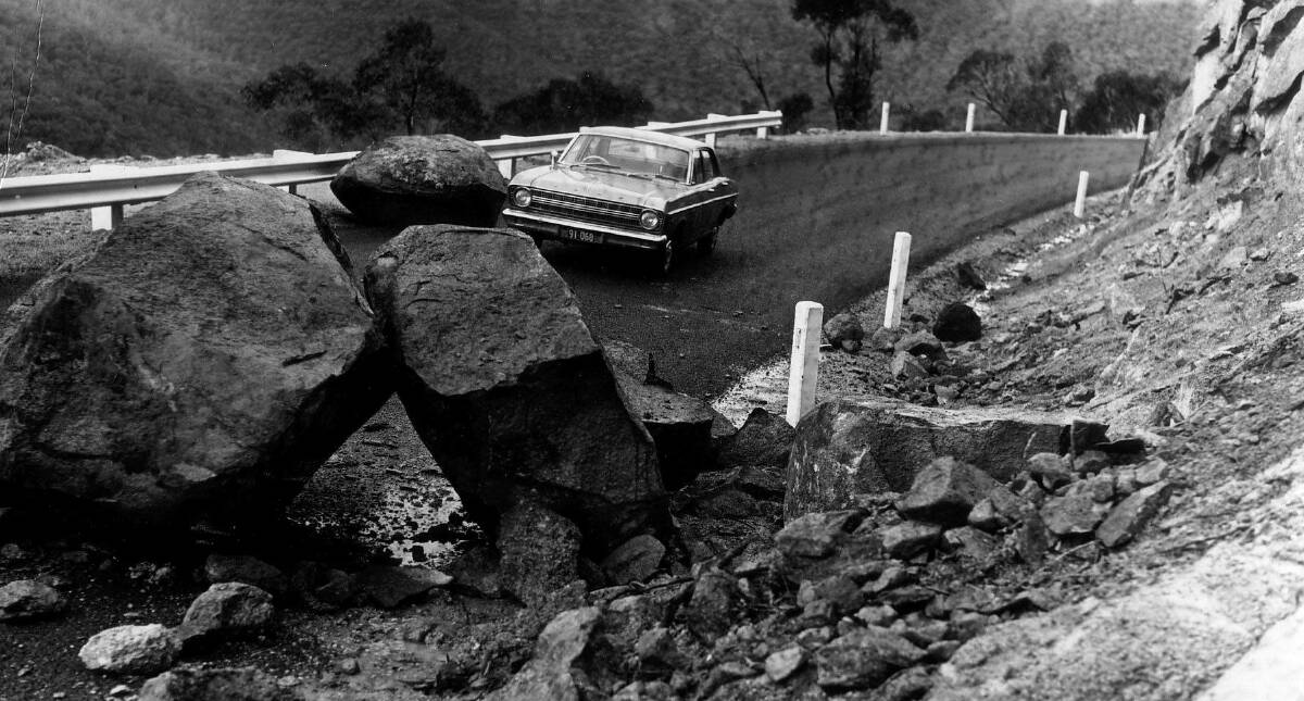 Despite the new bitumen Apollo Road opening in late 1967, rock falls like this one in May 1968 continued to be a problem. Picture: Hamish Lindsay and Mike Dinn
