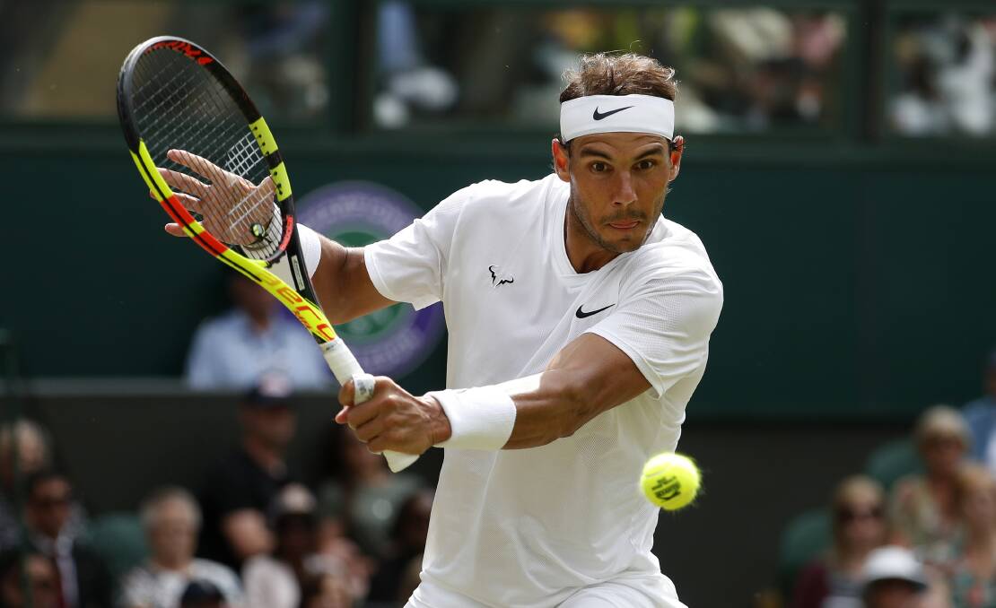 Rafael Nadal returns the ball during a men's quarterfinal match against United States' Sam Querrey. Picture: AP