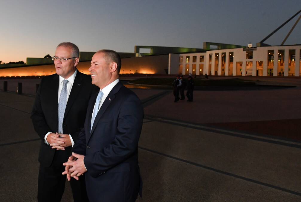 Treasurer Josh Frydenberg (right) with Prime Minister Scott Morrison outside Parliament House following the handing down of the federal budget in April. Picture: AAP Image/Mick Tsikas