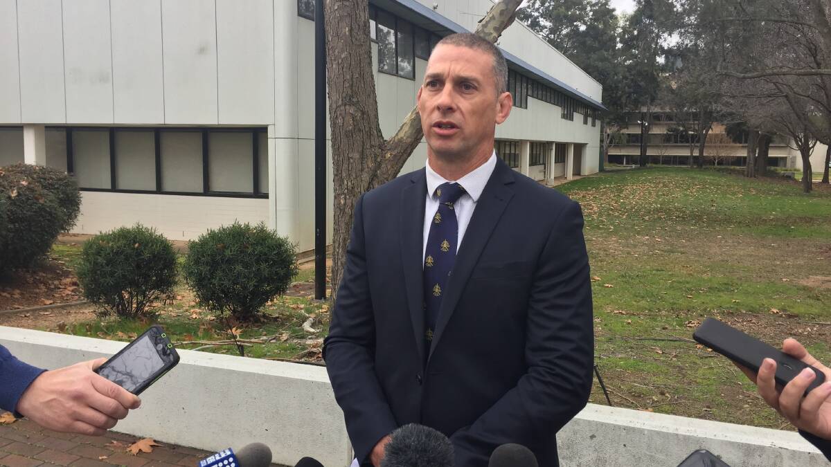 Detective acting station sergeant Shane Scott addresses the media in relation to a spate of ram raids in Canberra. Picture: Andrew Brown
