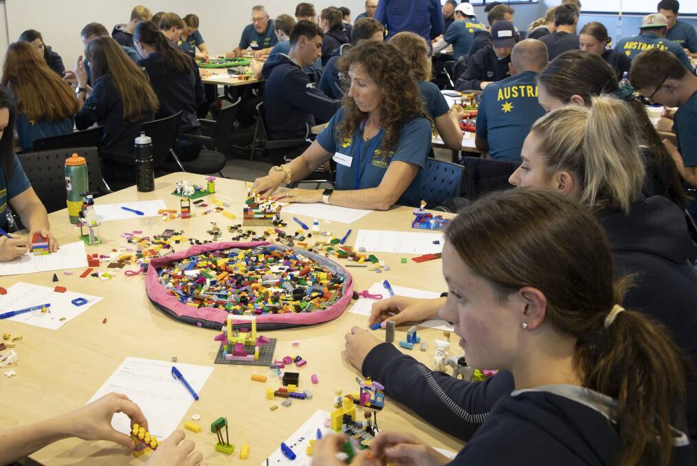 Australian junior swimmers participate in a lego building exercise as part of a week long AIS camp in the lead-up to the world junior swimming championships in Budapest in August. Picture: Sitthixay Ditthavong