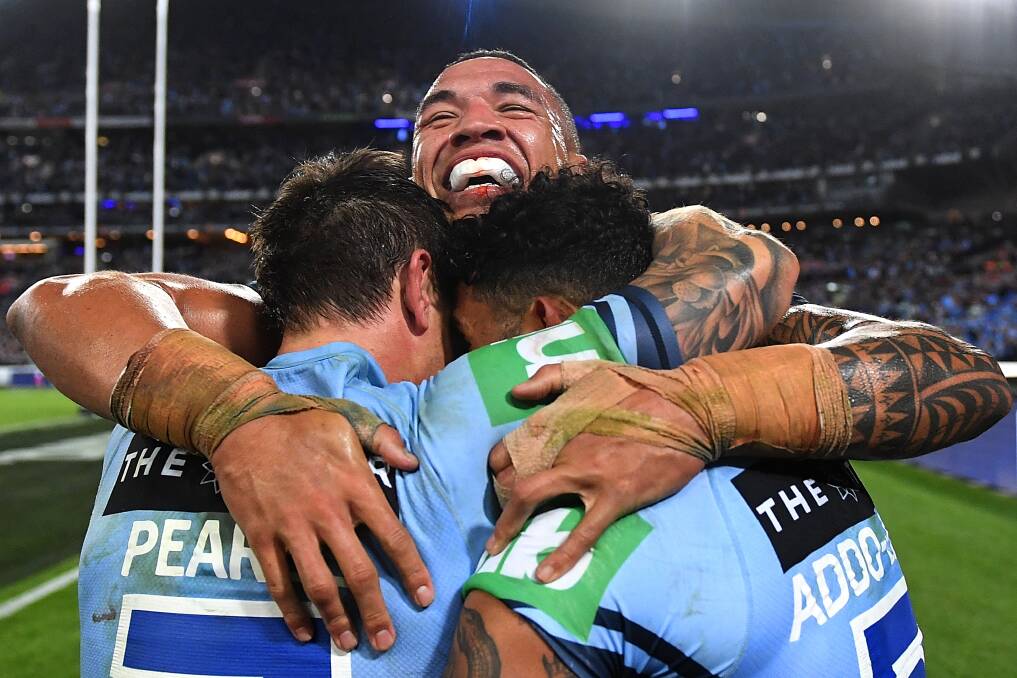 Mitchell Pearce, Tyson Frizell and Josh Addo-Carr celebrate winning the State of Origin decider in Sydney. Picture: AAP