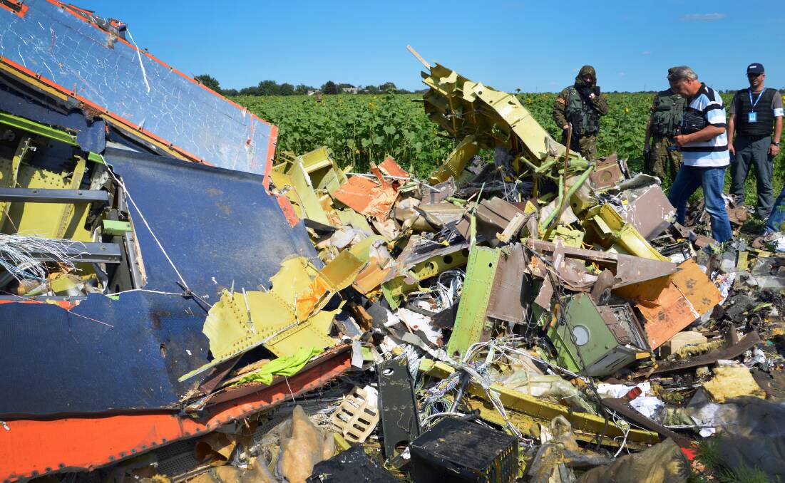 After MH17 was shot down at cruising altitude, much of the wreckage broke apart into near-unrecognisable materials. Picture: AFP