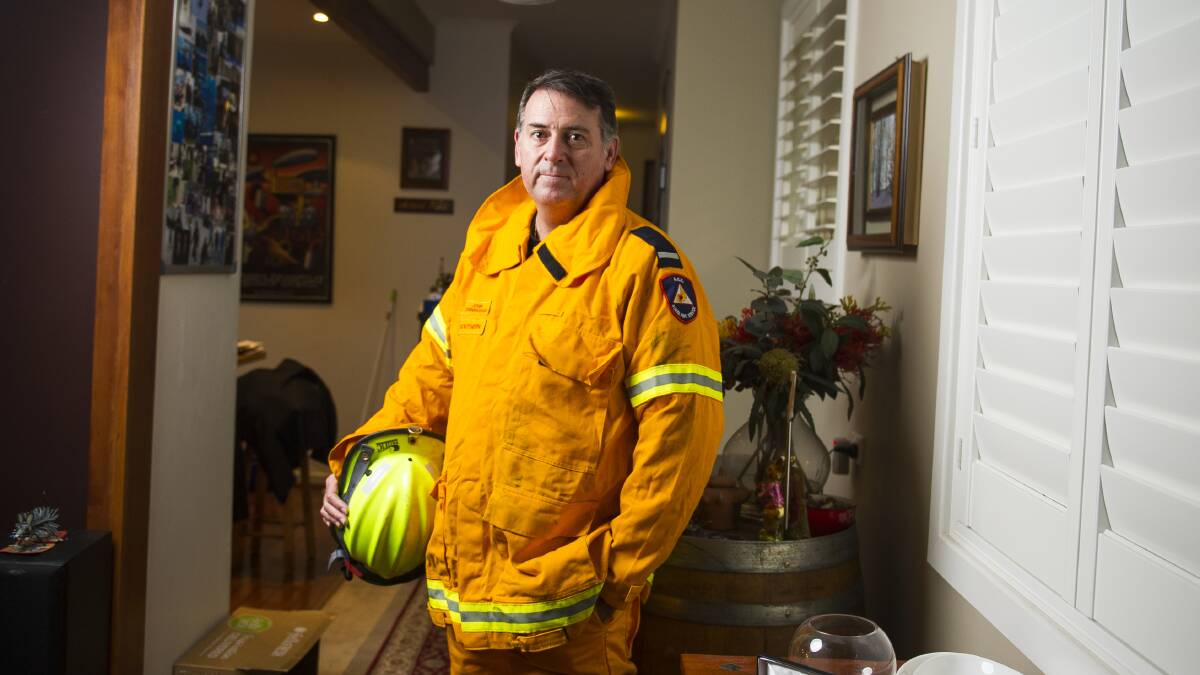 John Cunningham, pictured at his Torrens home, has received an award for over 30 years of service to the RFS. Picture: Dion Georgopoulos
