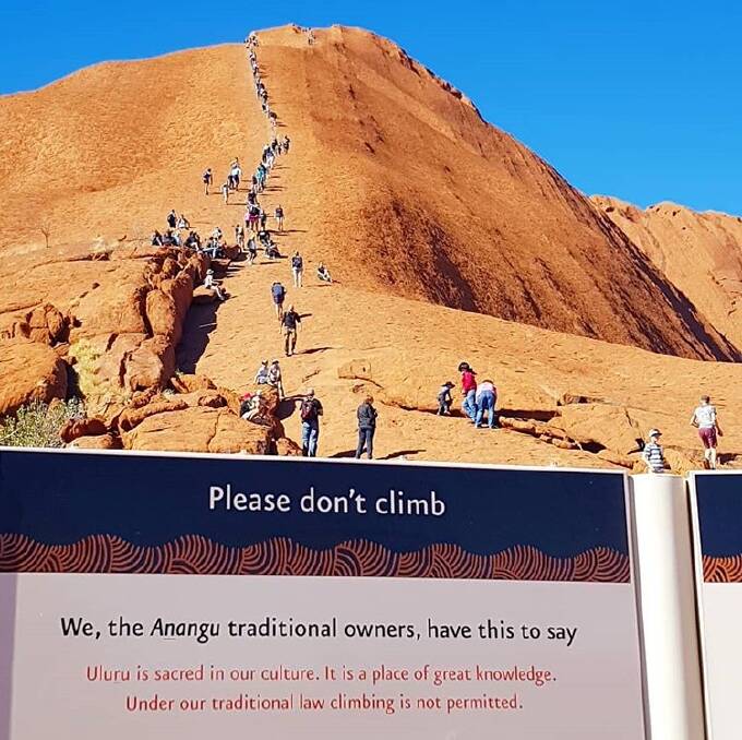 Tourists climbing Uluru. Picture: Claire Turfrey/Instagram