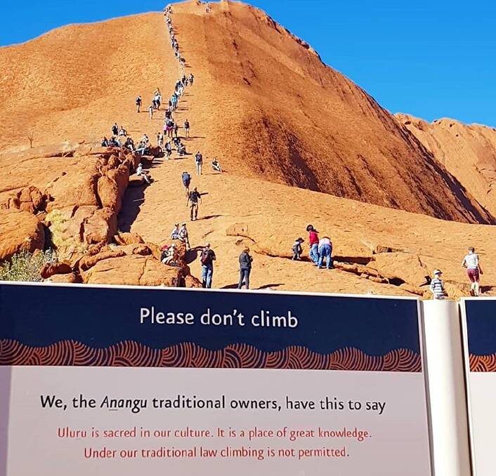 Tourists flocking to climb Uluru before the practice is banned in October are breaking laws and leaving rubbish and sewage. Picture: Claire Turfrey/Instagram