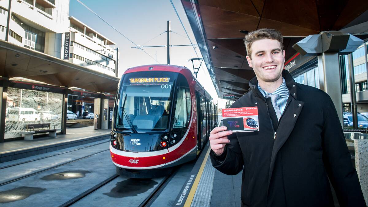 Passenger Jordan Bradfield, of Hackett, with a commemorative MyWay card with $20 credit. Picture: Karleen Minney