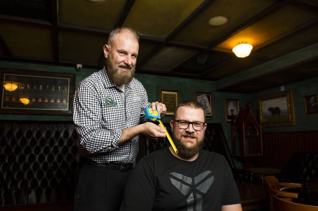 King O'Malley's Peter Barclay judges Jordan Tracey's beard. Picture: Dion Georgopoulos