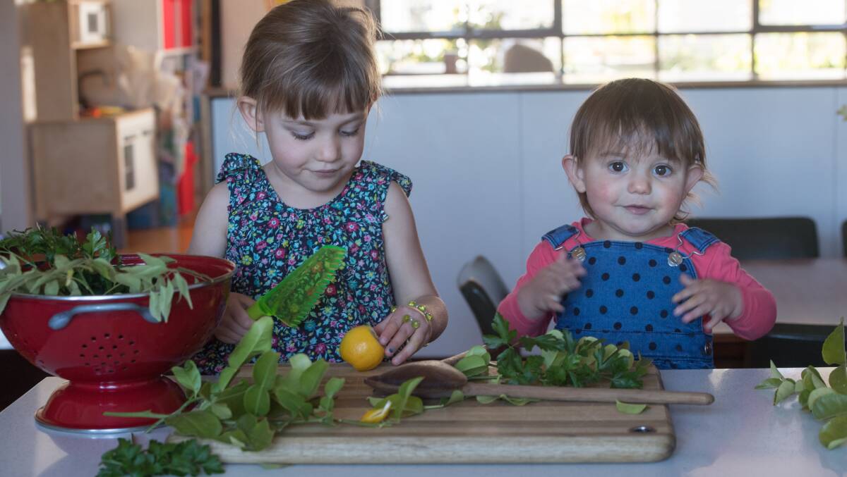 Esther and Eloise help prepare the vegetables for the soup. Picture: Karleen Minney