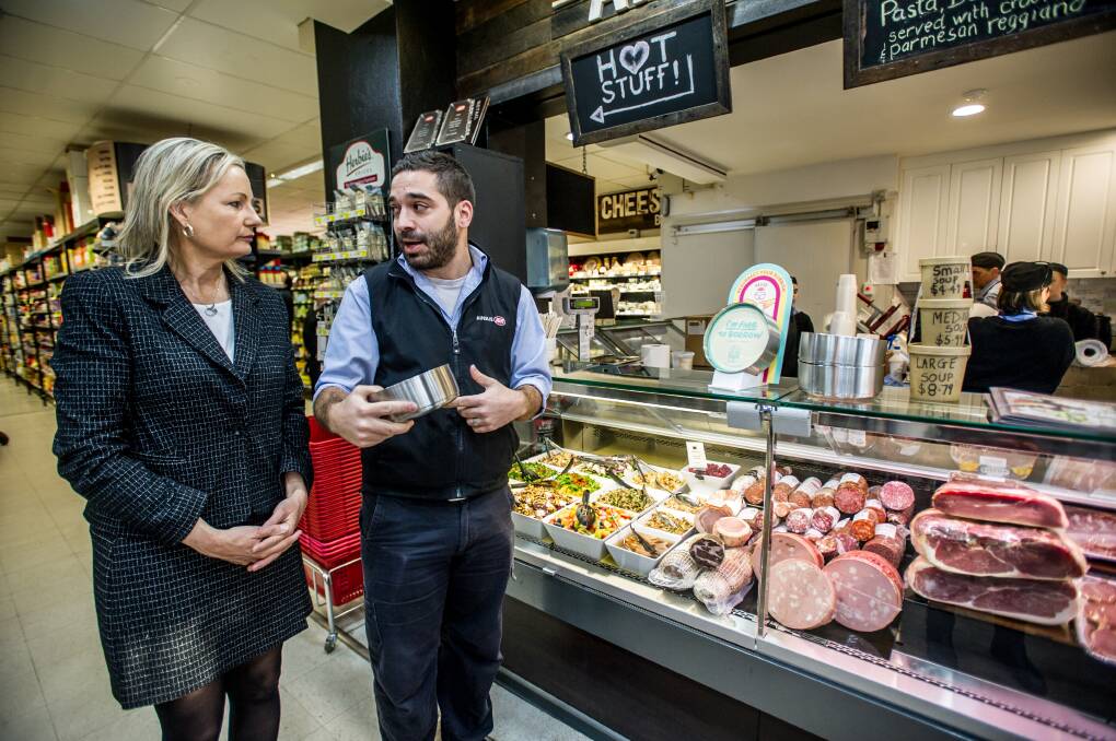Environment Minister Sussan Ley and Ainslie IGA manager Dimitri Mihailakis discuss reusable containers as part of Plastic Free July. Picture: Karleen Minney