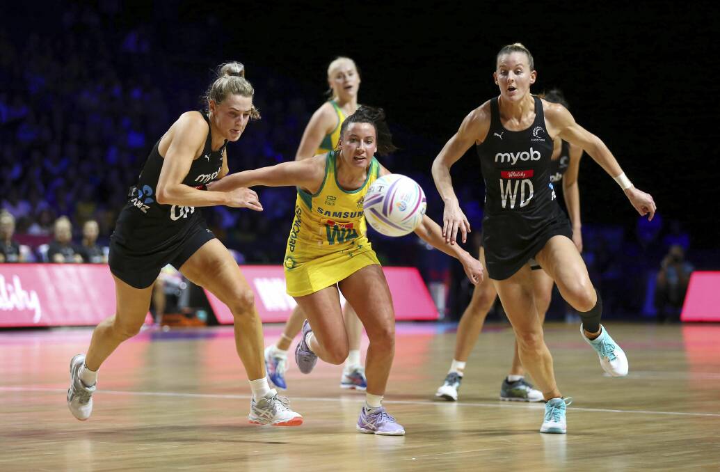 Australia's Kelsey Browne, center, in action against New Zealand's Jane Watson in Liverpool on Thursday. Picture: Nigel French/PA via AP
