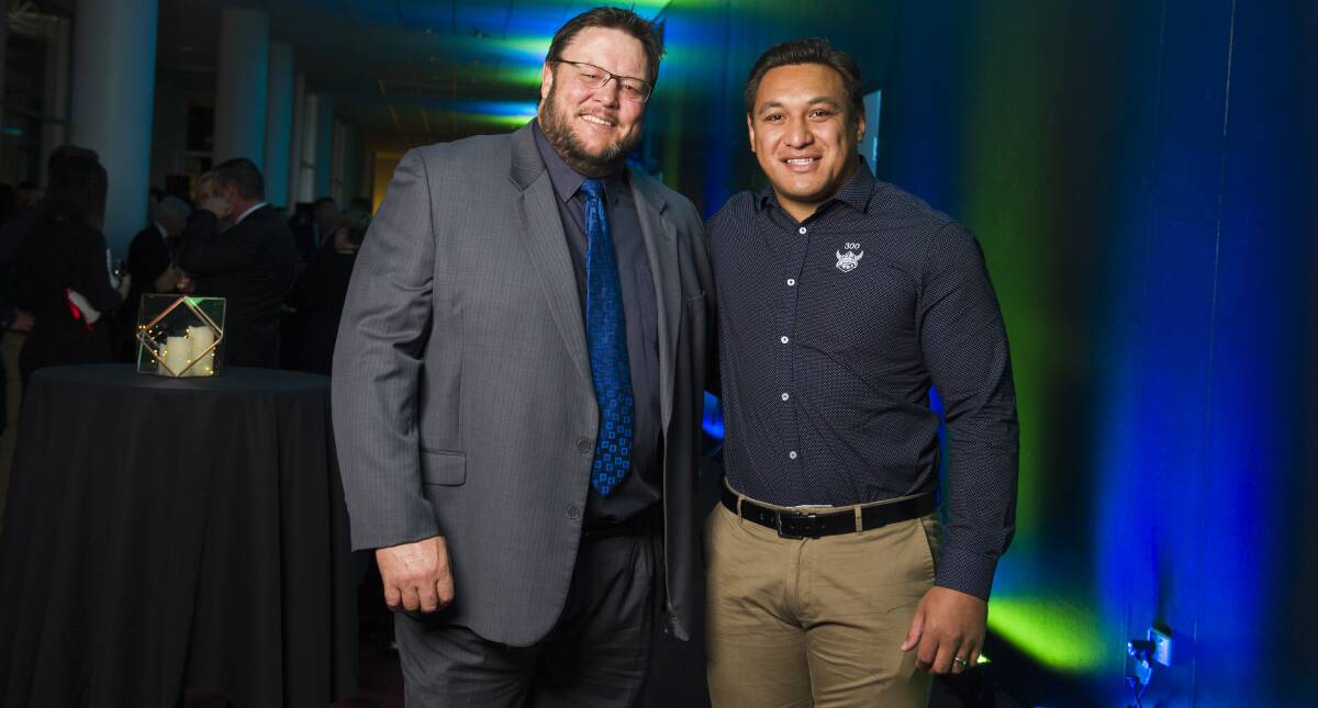 Raiders great Glenn Lazarus, left, with current Canberra enforcer Josh Papalii. Picture: Dion Georgopoulos