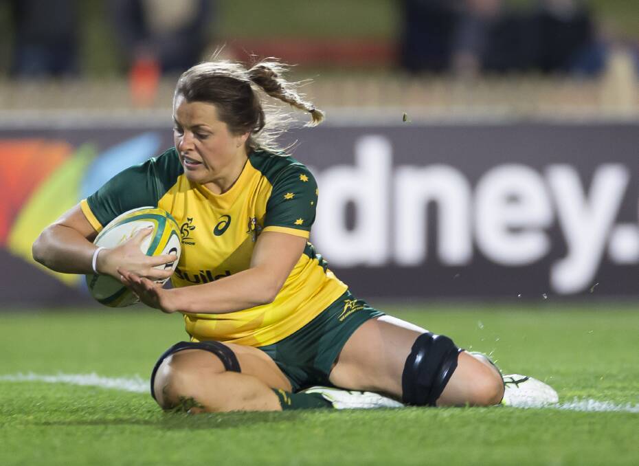 Grace Hamilton, of the Wallaroos, scores during the Women's International Rugby match between Australia and Japan in Sydney. Picture: AAP