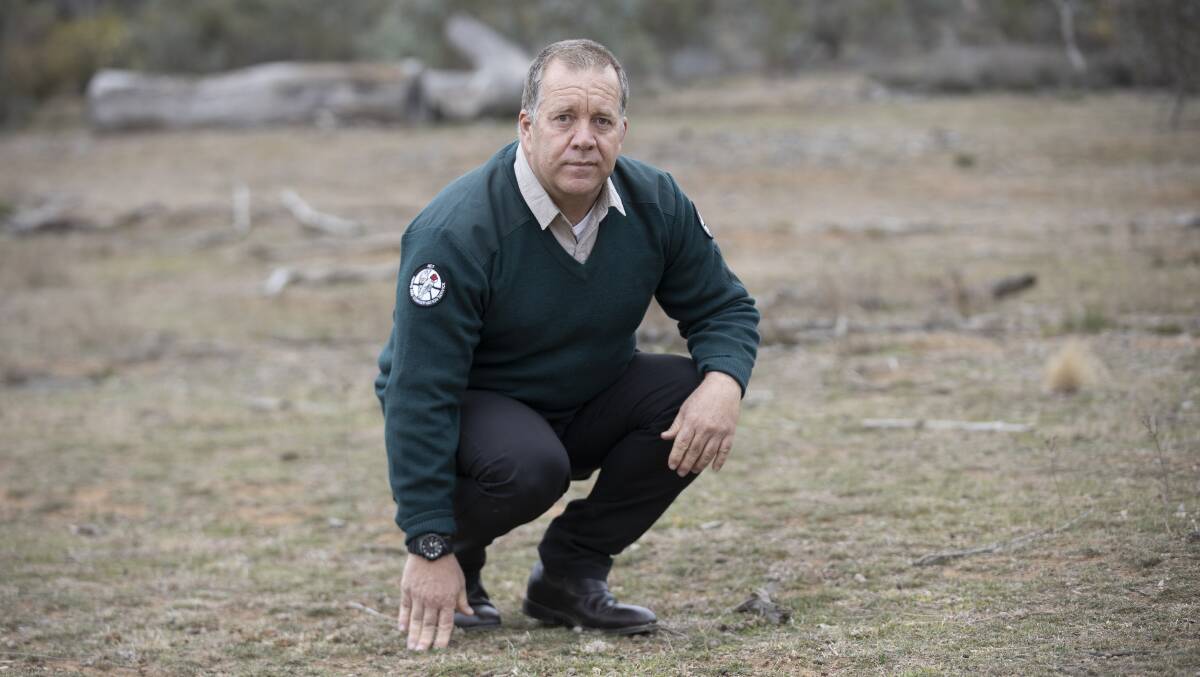 ACT Parks acting director Justin Foley in a heavily grazed area of the Mt Majura nature reserve. Picture: Sitthixay Ditthavong