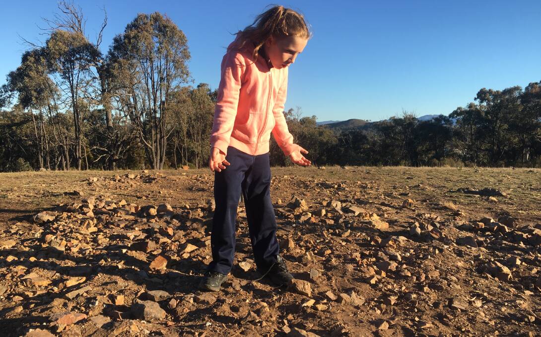 Emily, Tim's daughter, wonders where all the rocks have gone. Picture: Tim the Yowie Man