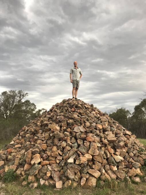 David Osmond stands atop the larger of the two rock cairns on Gossan Hill in 2017. Picture: Meg Osmond