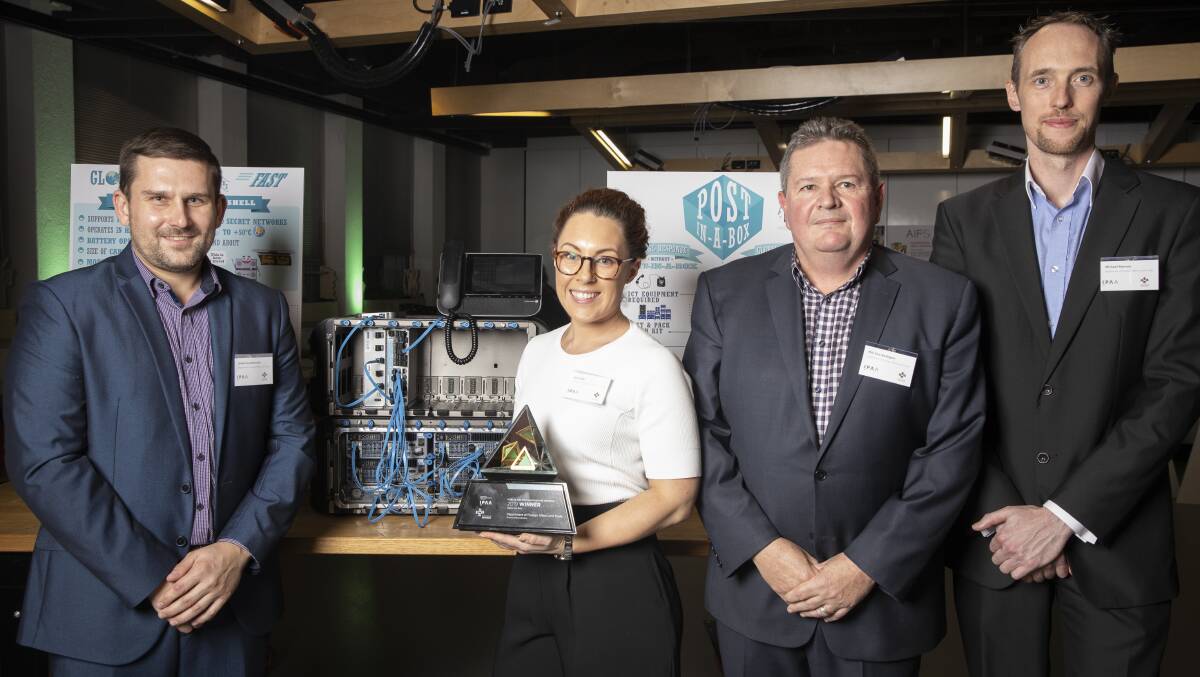 DFAT has won a public service innovation award for its new global secure communications system Post in a Box. L-R: DFAT staff James Kwiatkowski, Sara Lodo, Phil Van Bodegom, and Michael Ranson. Picture: Sitthixay Ditthavong