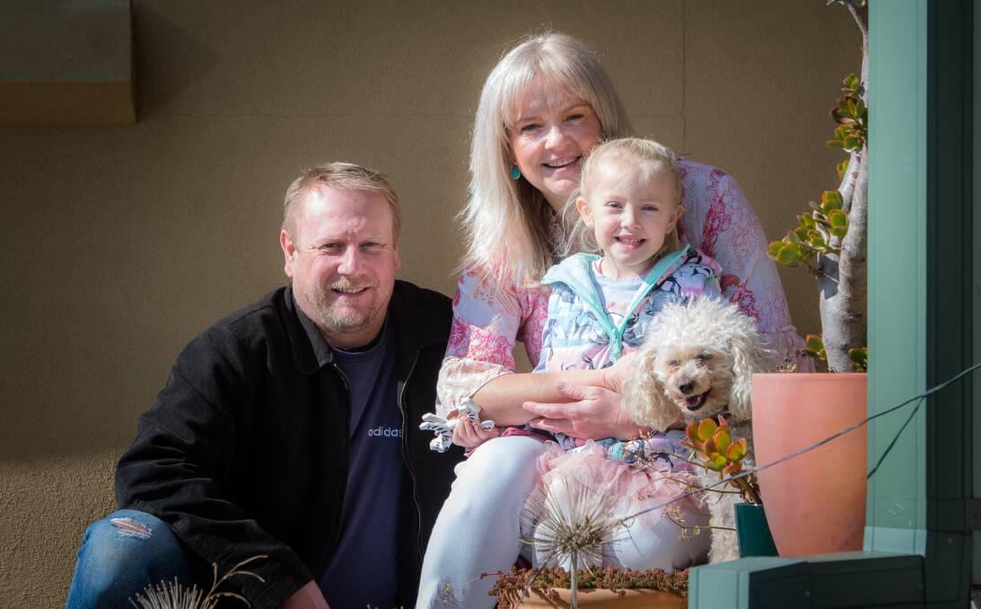 Greg and Liz Walton at home in Queanbeyan with daughter Willow and Bella the dog.. Picture: Elesa Kurtz