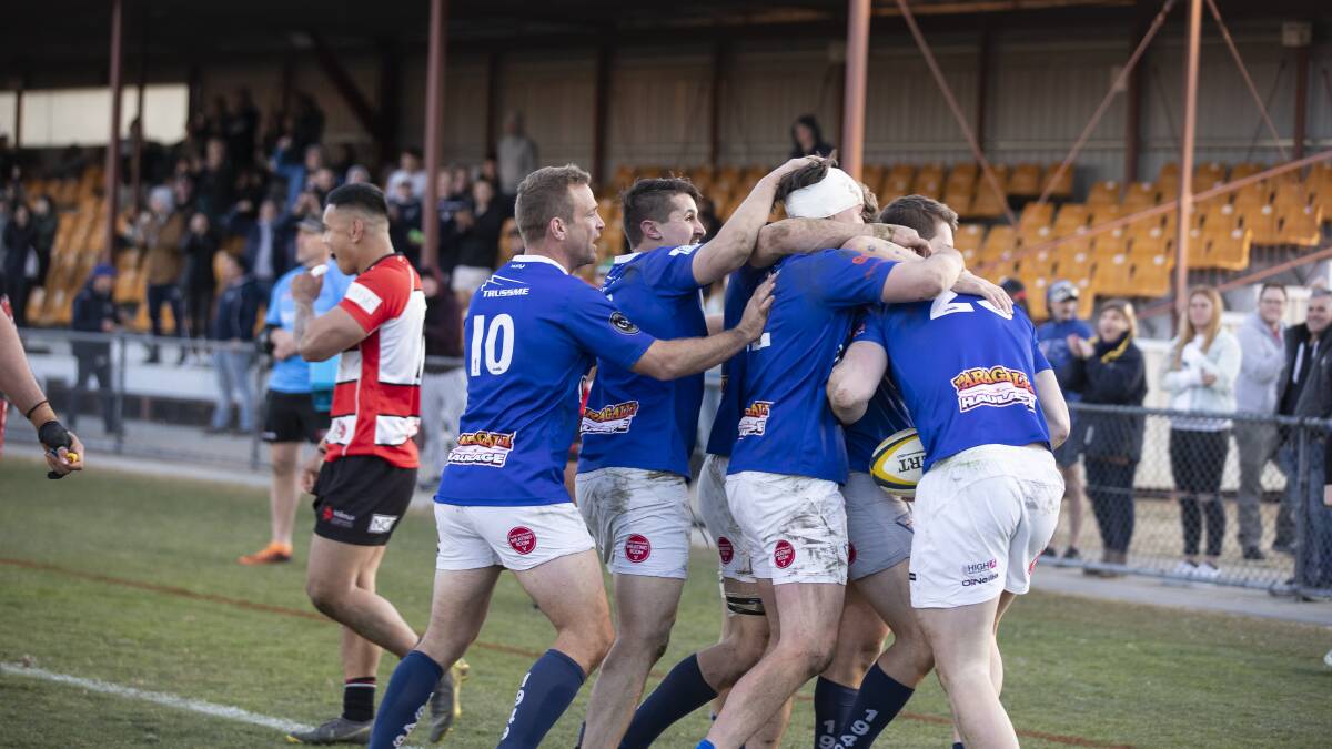 Canberra Royals players celebrate after Lincoln Smith scored the winning try in the corner. Picture: Sitthixay Ditthavong