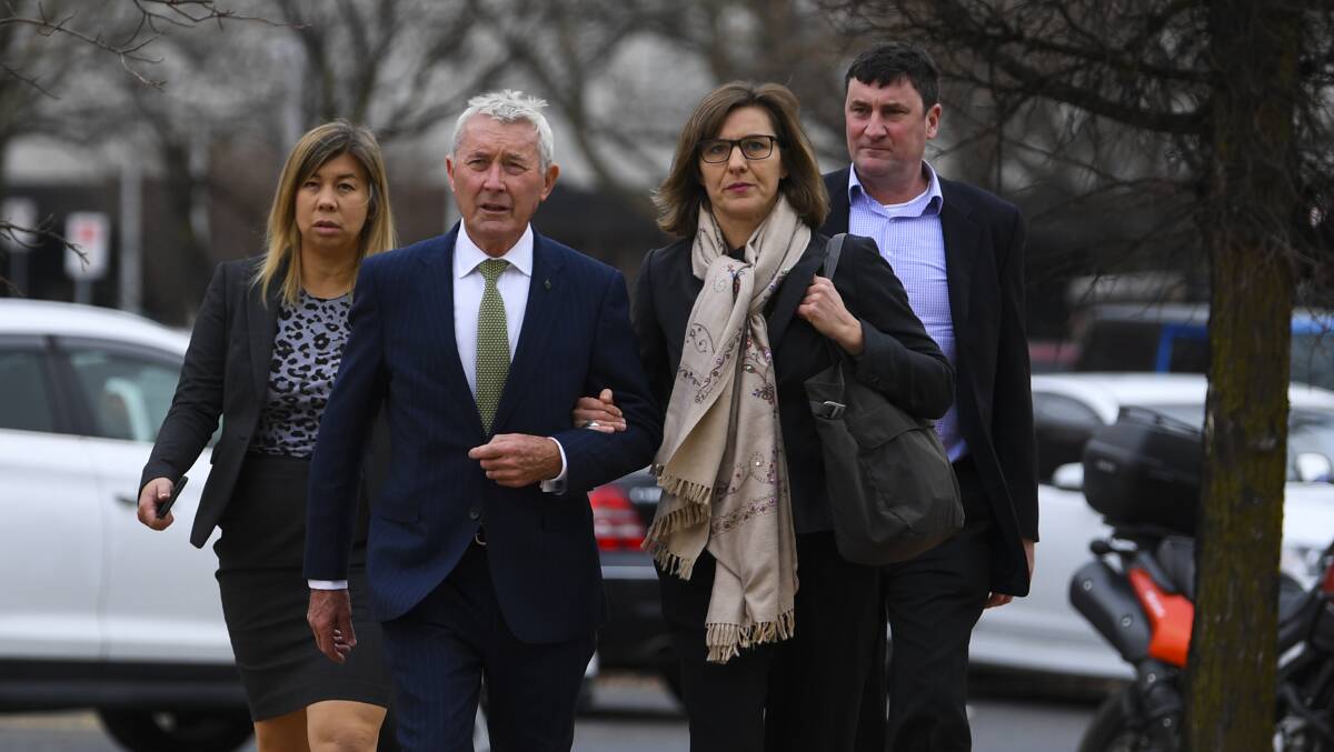 Lawyer Bernard Collaery (left) arrives with supporters on Tuesday. Picture: AAP
