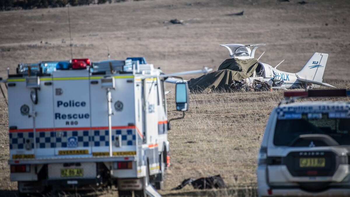 A fixed wing aircraft crashed into farmland in the Braidwood area, killing the single occupant. Emergency services attend the scene. Picture: Karleen Minney
